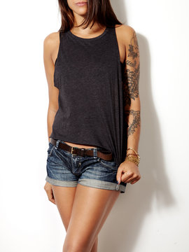 young tattooed woman wearing blank sleeveless t-shirt
