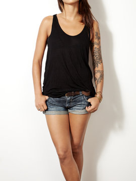 young tattooed woman wearing blank sleeveless t-shirt