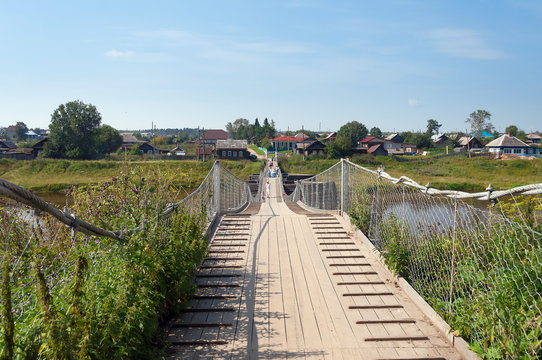 Old suspension bridge over the River Tura