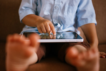 Close-Up of Young Boy Using Tablet Computer