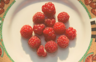 Close-up Fresh raspberry in a white bowl vintage