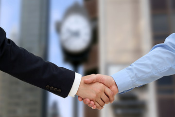 Close-up image of a firm handshake  between two colleagues