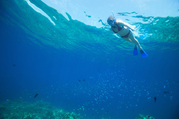 Woman snorkeling in tropical water