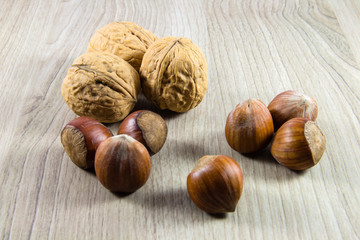 Mix of nuts on a wooden background