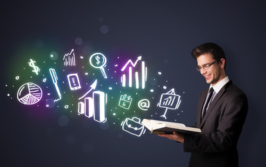 Young guy reading a book with business icons