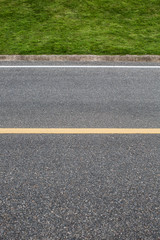 Asphalt road with marking lines. Close-up background texture wit