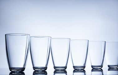 column of empty water glasses