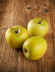 Fresh harvested apples on wood
