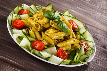 Pasta with pesto sauce, parmesan and vegetables