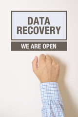 Businessman knocking on Data Recovery Office door