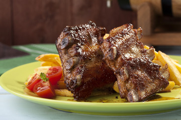 Grilled ribs on plate