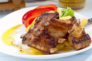 Grilled ribs on plate