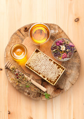 Fototapeta premium Honey, dried herbs and herbal tea