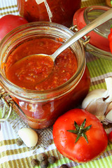 Bank of ketchup, vegetables and spices.