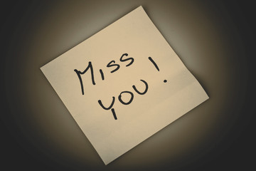Yellow note paper miss you message