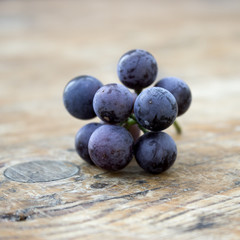 Grapes on a old wooden table.