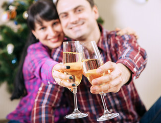 Close up image couple hands with bubble wine goblets