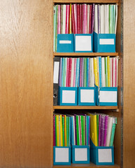 Colour file folders in office cupboard