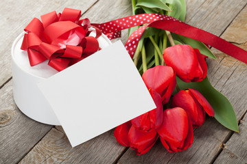 Fresh tulips, gift box and greeting card