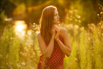 Beautiful woman in a dress of wildflowers