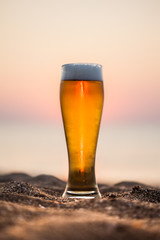Glass of beer on a sunset