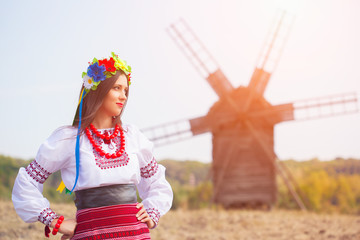 beautiful young woman wearing national ukrainian clothes posing
