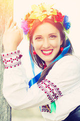 beautiful young woman wearing national ukrainian clothes posing