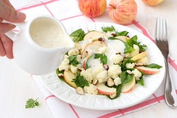 Cauliflower salad with apples and nuts