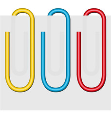 sheet of paper and three giant clips