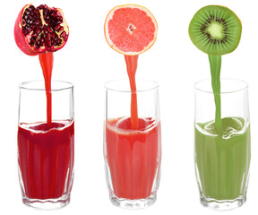 Juice pouring from fruits into glass, isolated on white