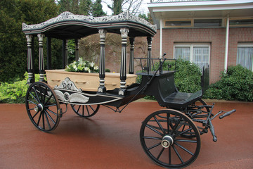 Classic funeral carriage with coffin