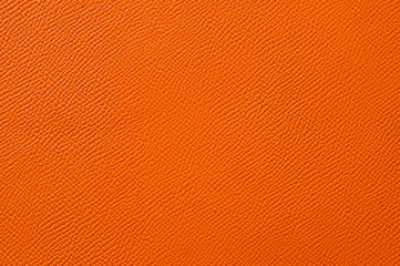 Closeup of seamless orange leather texture
