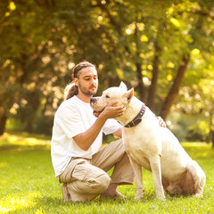 Man and Dog Argentino walk in the park.
