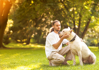 Man and Dog Argentino walk in the park.