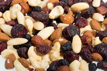 mixed nuts and dried fruits isolated on white background