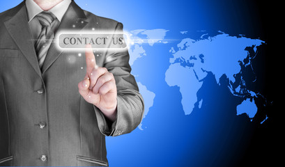 businessman hand pushing contact us button