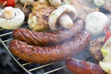 barbecue with delicious grilled meat and vegetables on grill