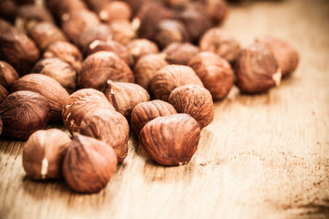 Hazelnuts on rustic old wooden table