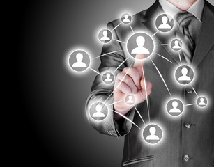 Businessman pressing modern social buttons