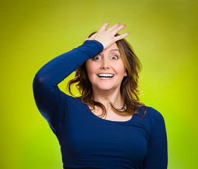 Woman placing hand on head palm on face gesture in duh moment