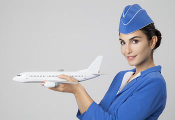 Charming Stewardess Holding Airplane In Hand.