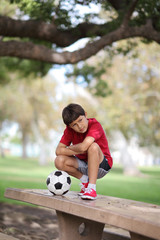 Boy in the park with soccer ball