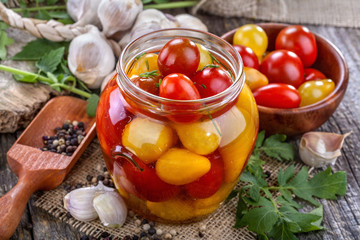 canned and preserved domestic tomato on an old rustic table
