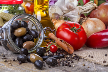 Black and green olives with olive oil and vegetables