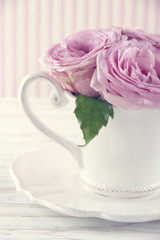 Cup filled with a bouquet of romantic pink roses3