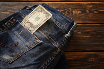 Creative composition of Money on the jeans