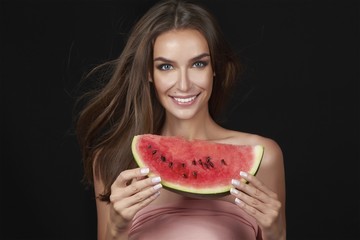 Beautiful sexy brunette woman eating watermelon diet organic