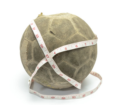 old football with measuring tape