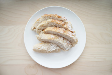 Bread served on white table
