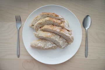 Bread served on white table